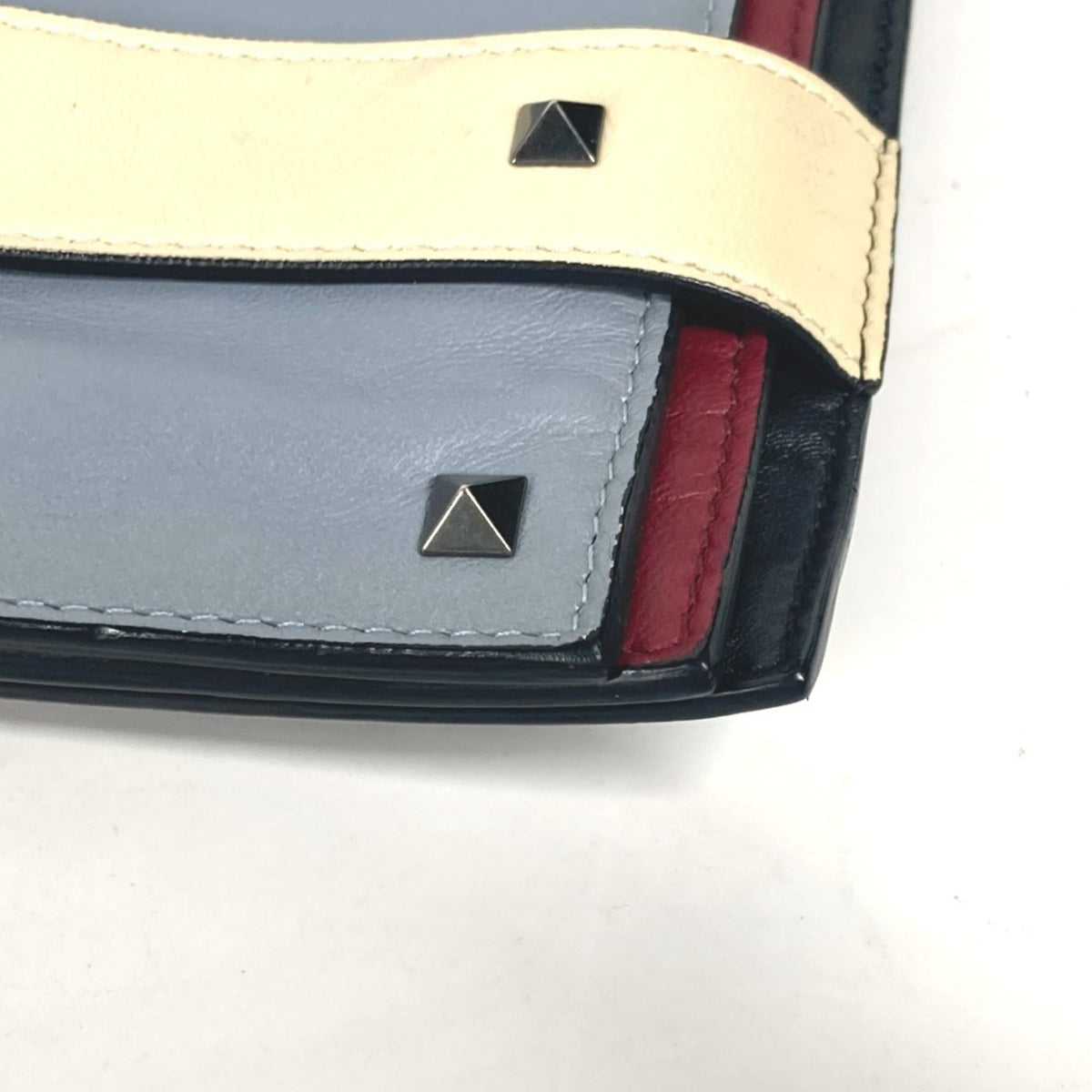 Rockstud Triple Zip Clutch Leather