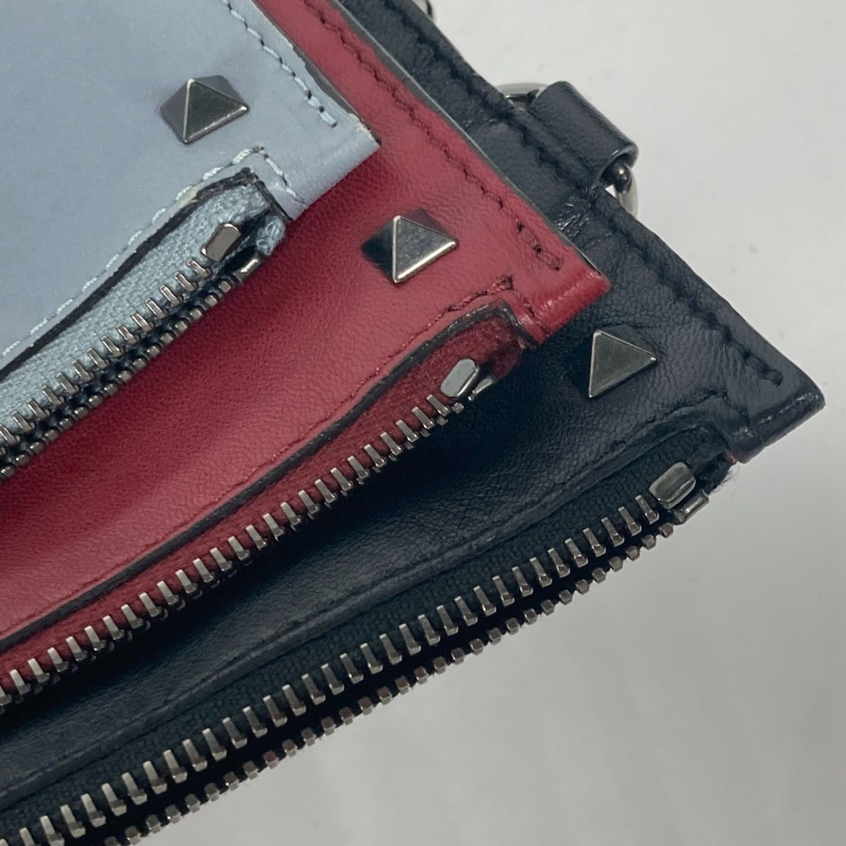 Rockstud Triple Zip Clutch Leather