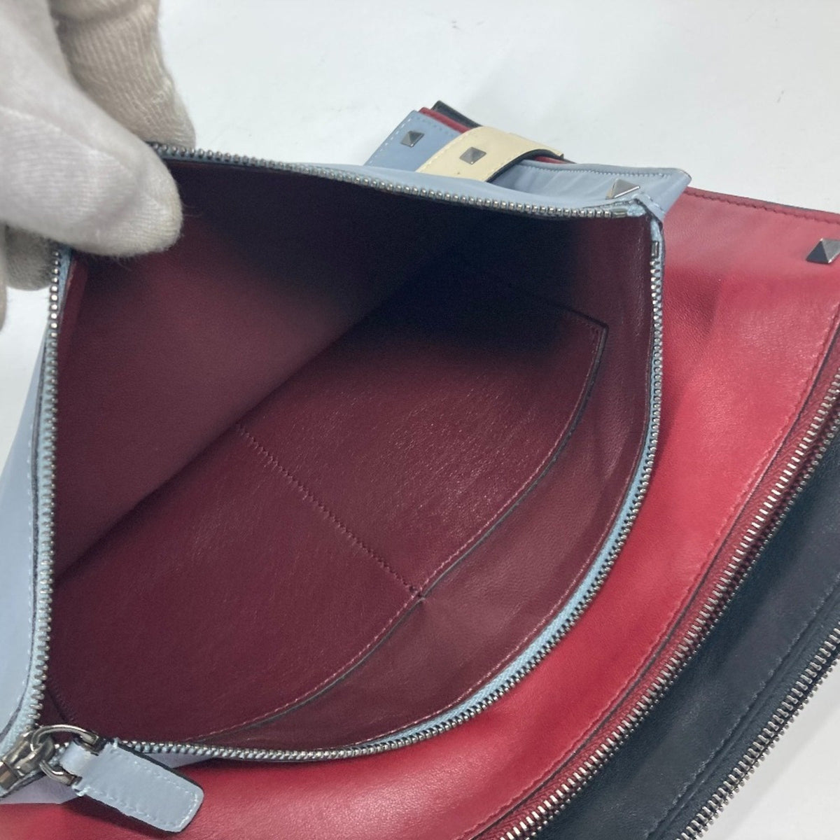 Rockstud Triple Zip Clutch Leather